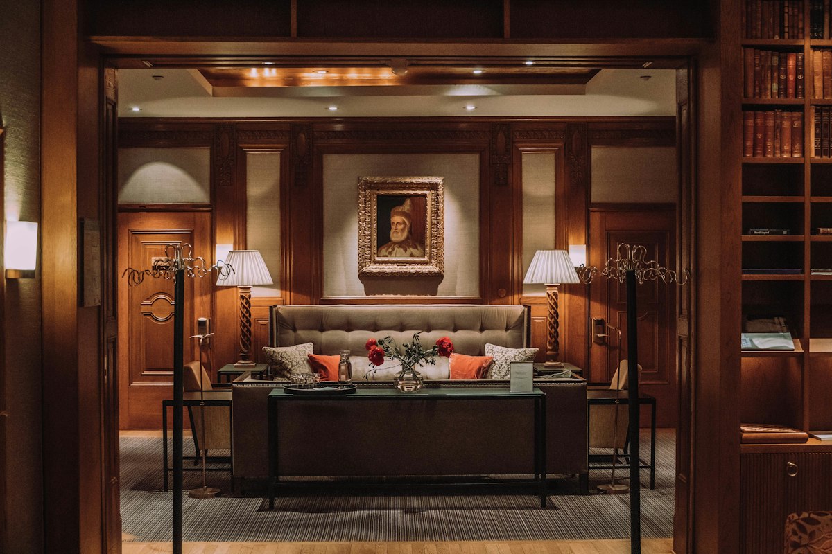 Managed WiFi access point in a Central Coast hospitality hallway — guest and staff networks by Current Networks
